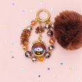 🤎✨ Autumn Ember Pom Phone Charm - Glow in the Dark